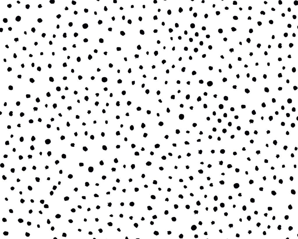 Een zwart-witte achtergrond met kleine zwarte stippen Een zwart-witte achtergrond met kleine zwarte stippen