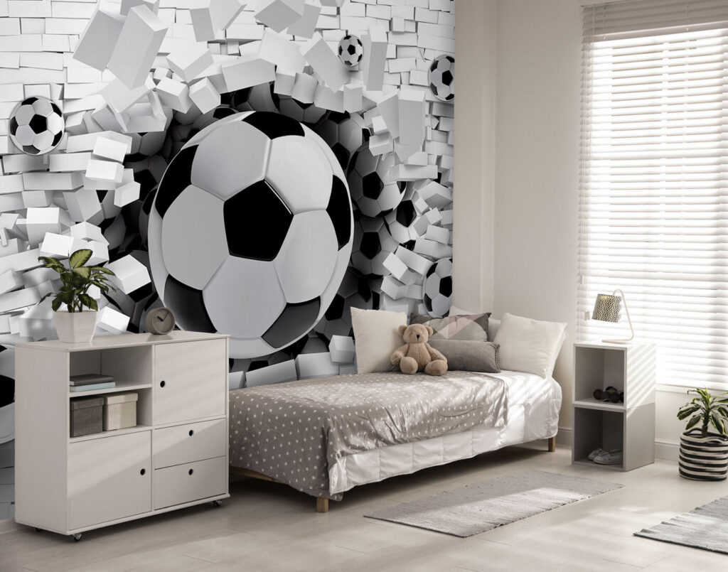 Football ball breaking through a brick wall Football ball breaking through a brick wall