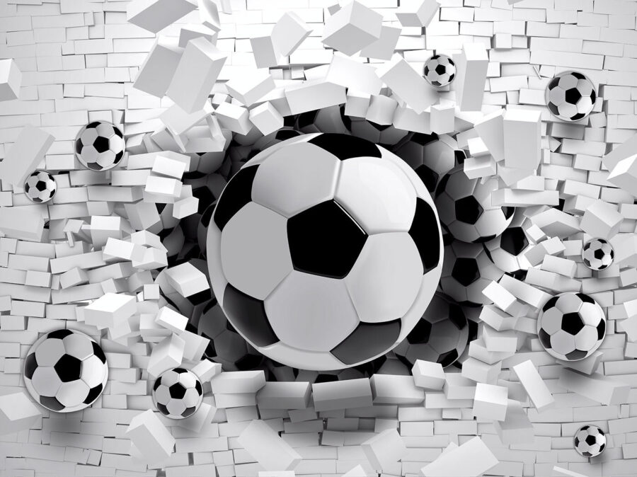 Football ball breaking through a brick wall Football ball breaking through a brick wall