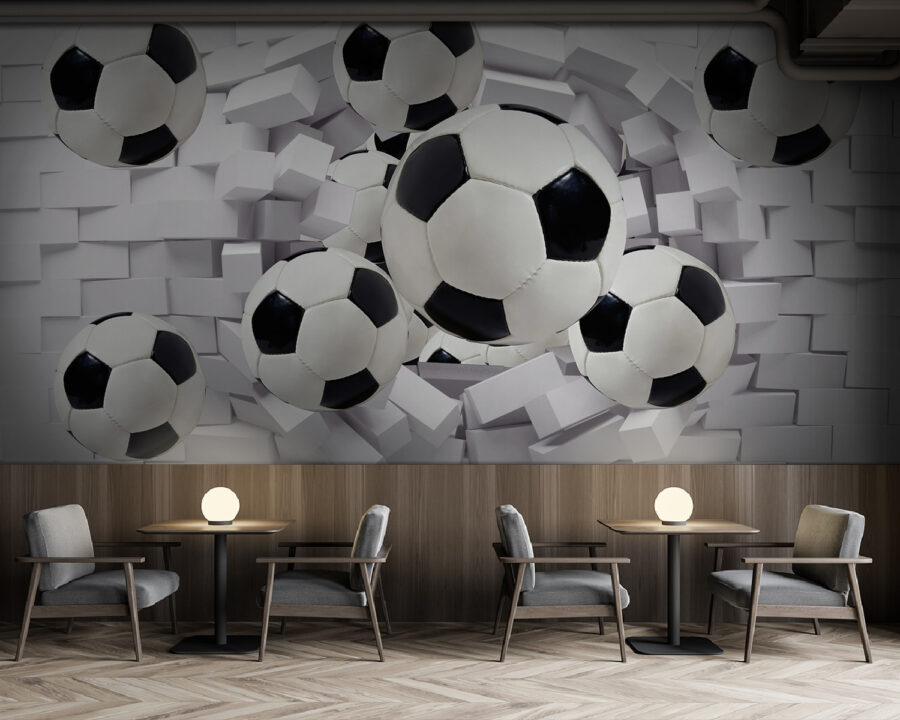 Groep voetballen vliegt over een muur