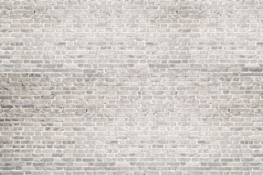 Witte bakstenen muur met grijze bakstenen