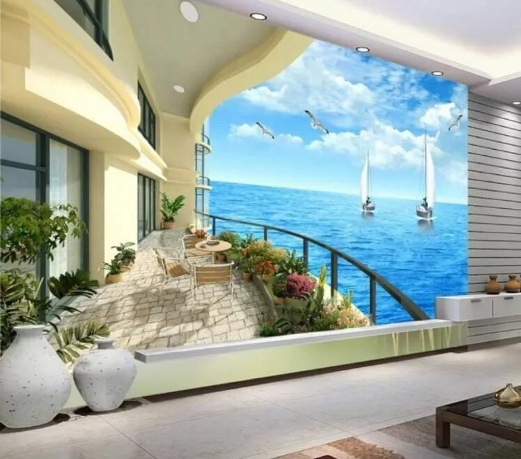 Balkon met uitzicht op de oceaan en boten