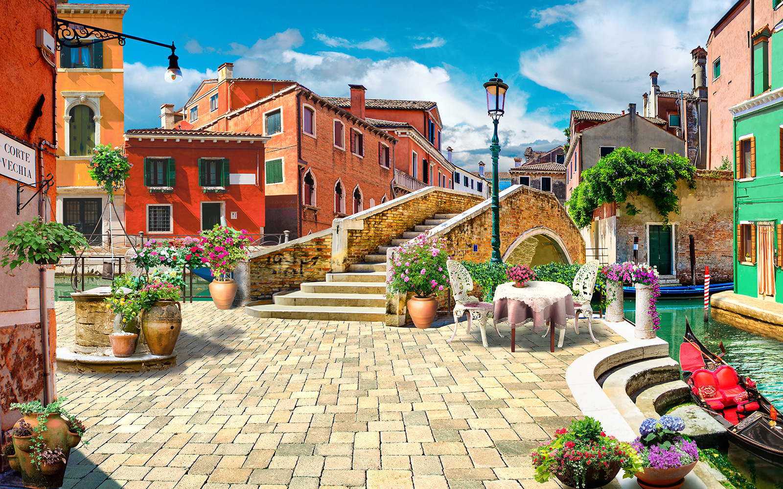 Patio met een tafel en stoelen en een fontein voor een gebouw u18551p - Patio met een tafel en stoelen en een fontein voor een gebouw - tegory