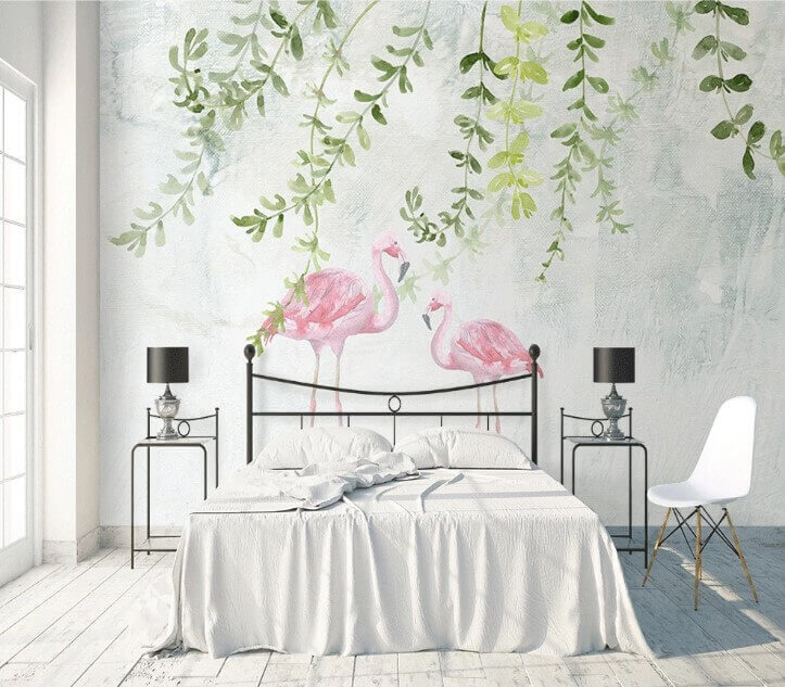 Twee roze flamingo's met groene bladeren