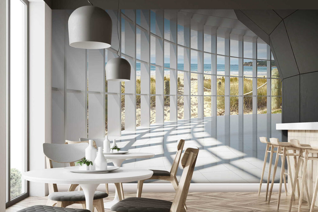 Large room with windows and a beach view