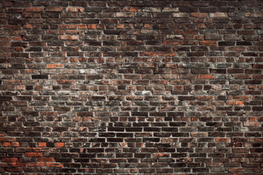 Bakstenen muur met zwarte en rode bakstenen Bakstenen muur met zwarte en rode bakstenen