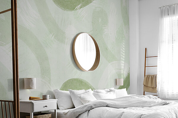 A white surface with green paint strokes