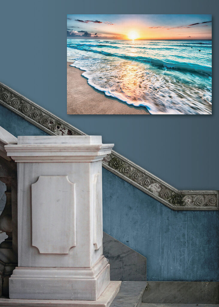 A beach with waves and a sunset