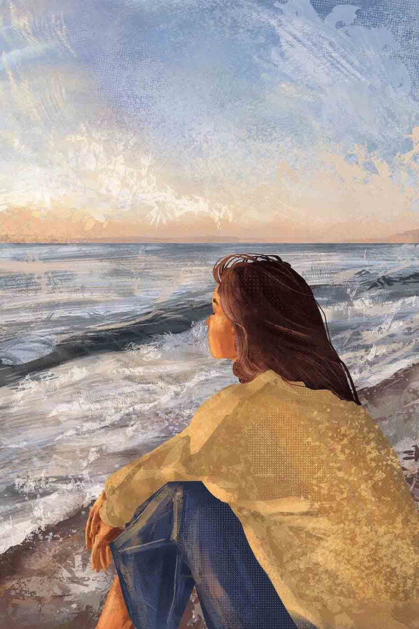Een vrouw op het strand met uitzicht op de oceaan Een vrouw op het strand met uitzicht op de oceaan