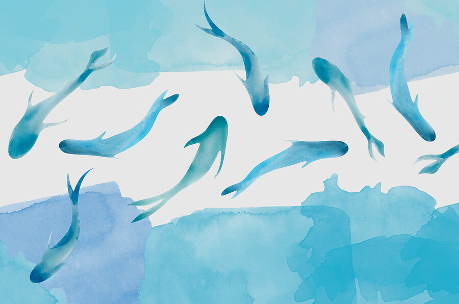 Een groep blauwe vissen zwemmend in water