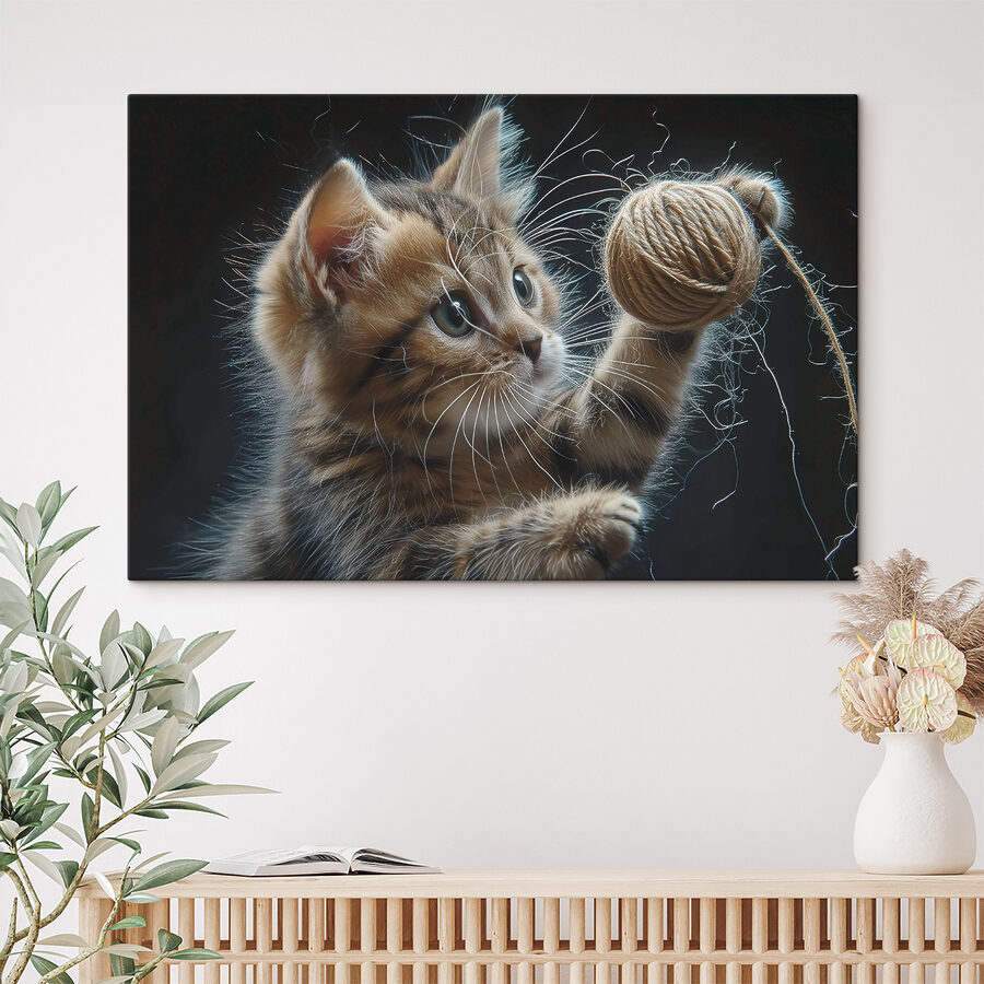 Een kat speelt met een bal garen Een kat speelt met een bal garen