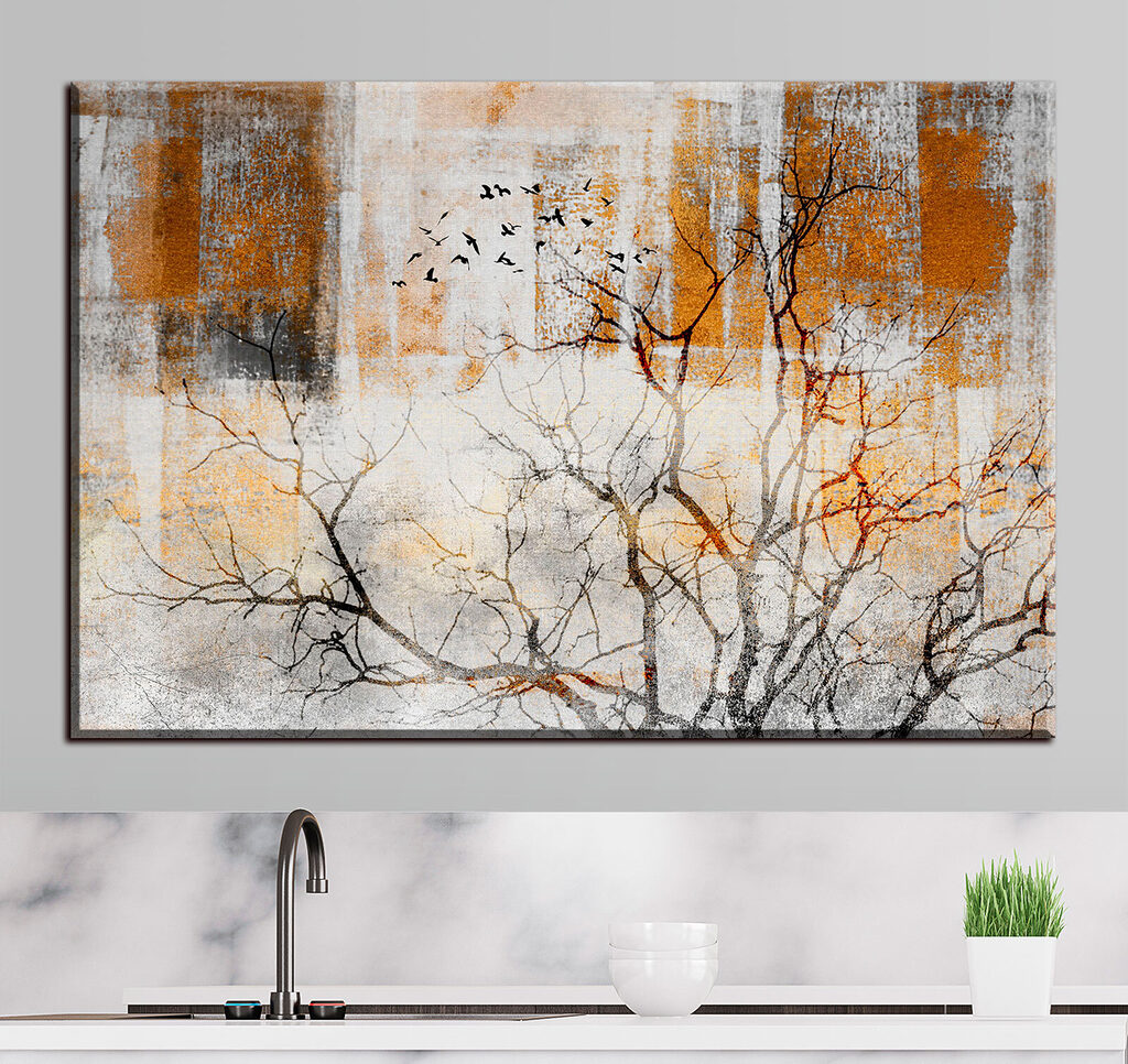 A tree with birds flying in the sky
