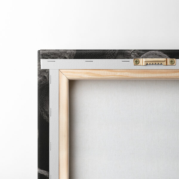 A statue of a woman with a cracked face and snakes around her face