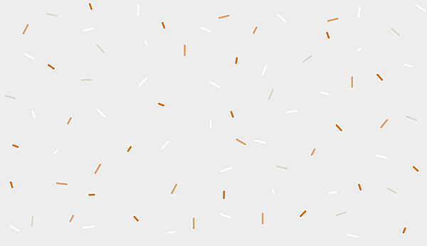 Een witte en oranje hagelslag op een grijze achtergrond Een witte en oranje hagelslag op een grijze achtergrond