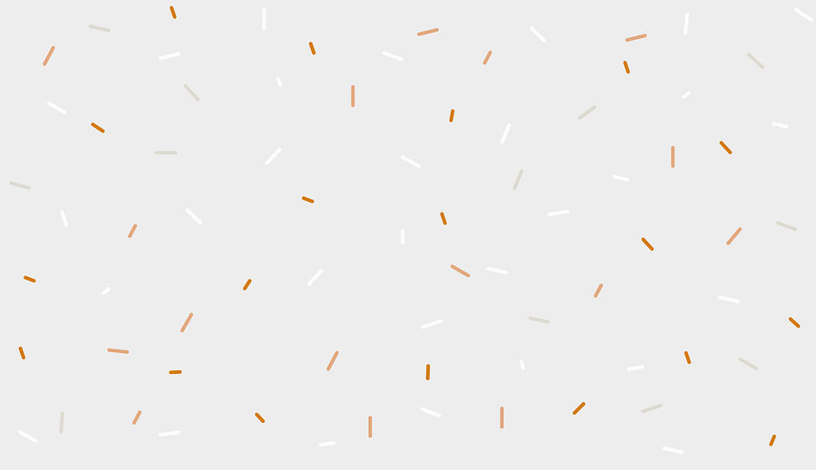 Een witte en oranje hagelslag op een grijze achtergrond
