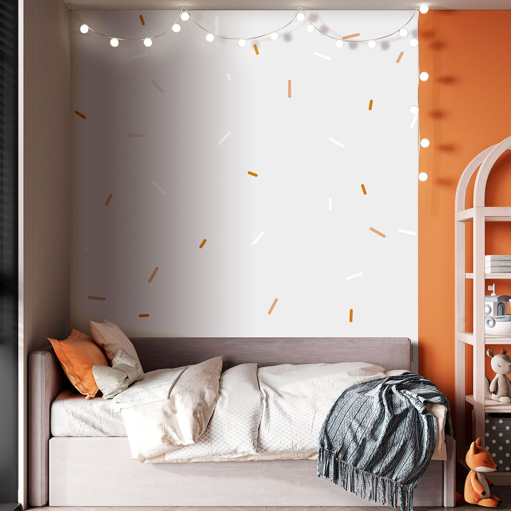 A white and orange sprinkles on a gray background