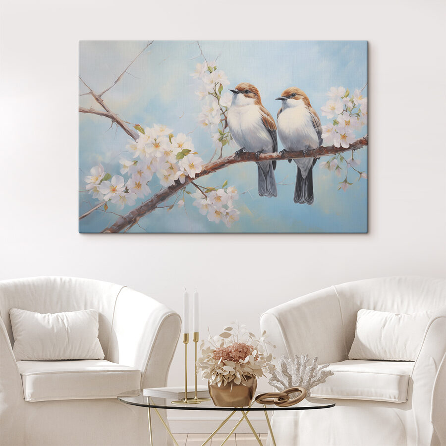 Twee vogels op een tak met witte bloemen