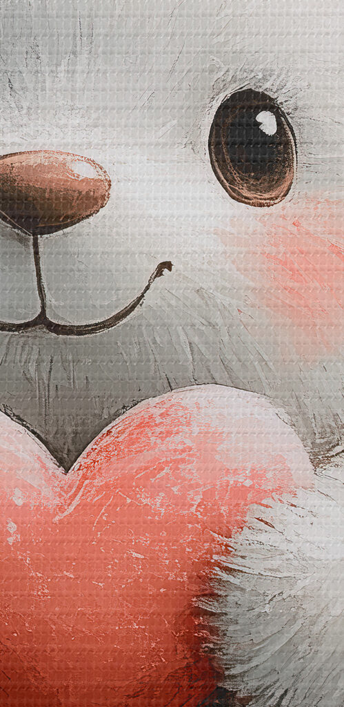 White teddy bear holding a heart