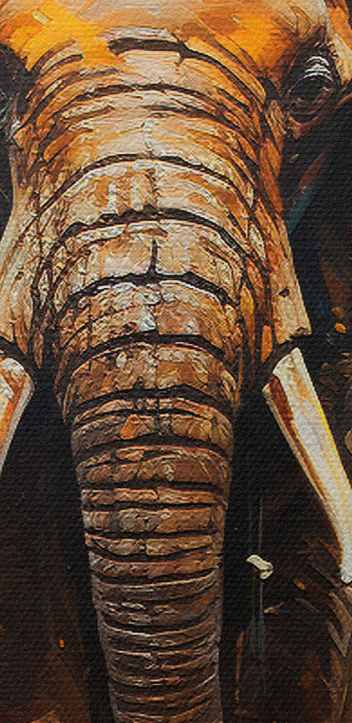 An elephant with tusks and dirt