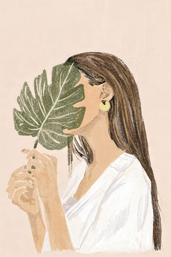 Vrouw die een blad vasthoudt Vrouw die een blad vasthoudt