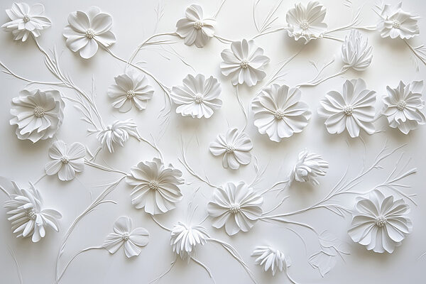 White paper flowers on a white surface White paper flowers on a white surface