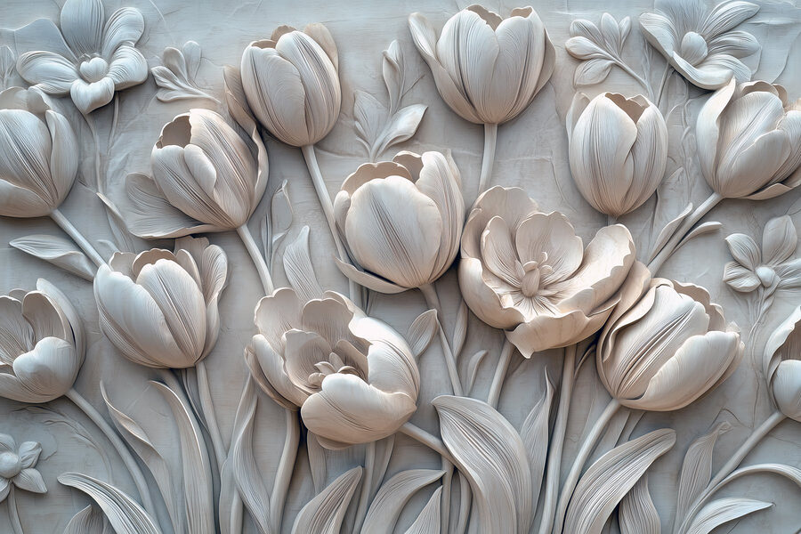 Snijwerk van witte bloemen op een muur