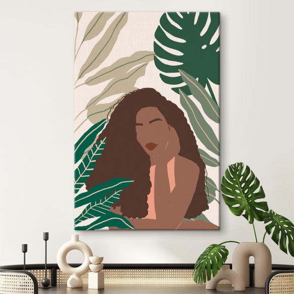 Vrouw met lang haar en een groene bladachtergrond Canvas Schilderijen Vrouw met lang haar en een groene bladachtergrond