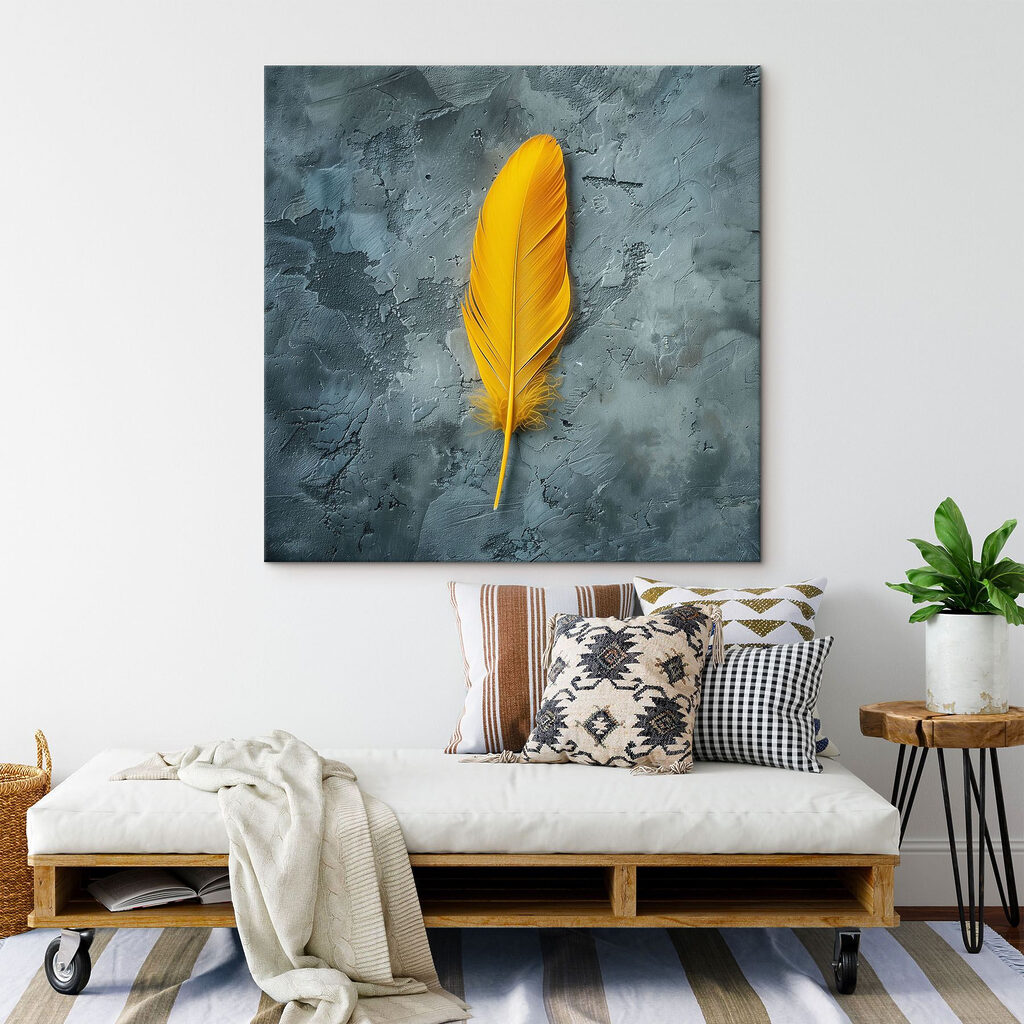 Yellow feather on a grey surface Yellow feather on a grey surface