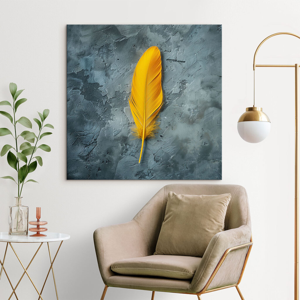 Yellow feather on a grey surface Yellow feather on a grey surface