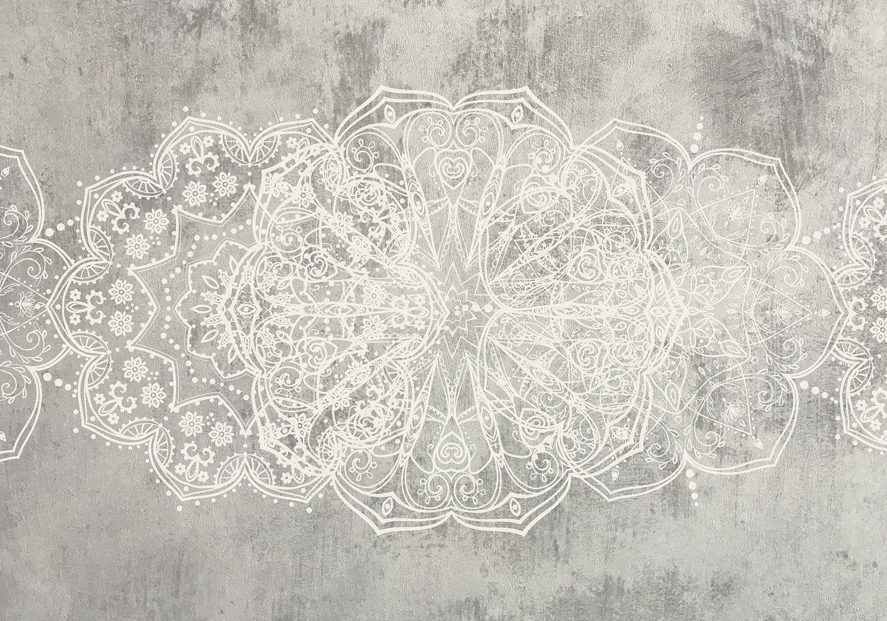 White ornate design on a grey surface White ornate design on a grey surface