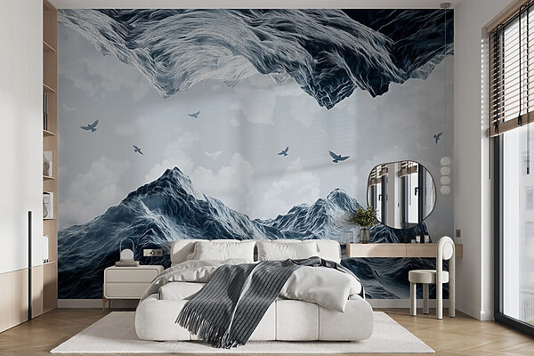Birds flying over a snowy mountain