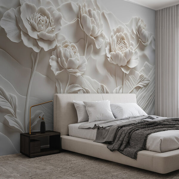 Snijwerk van witte bloemen op een muur Snijwerk van witte bloemen op een muur