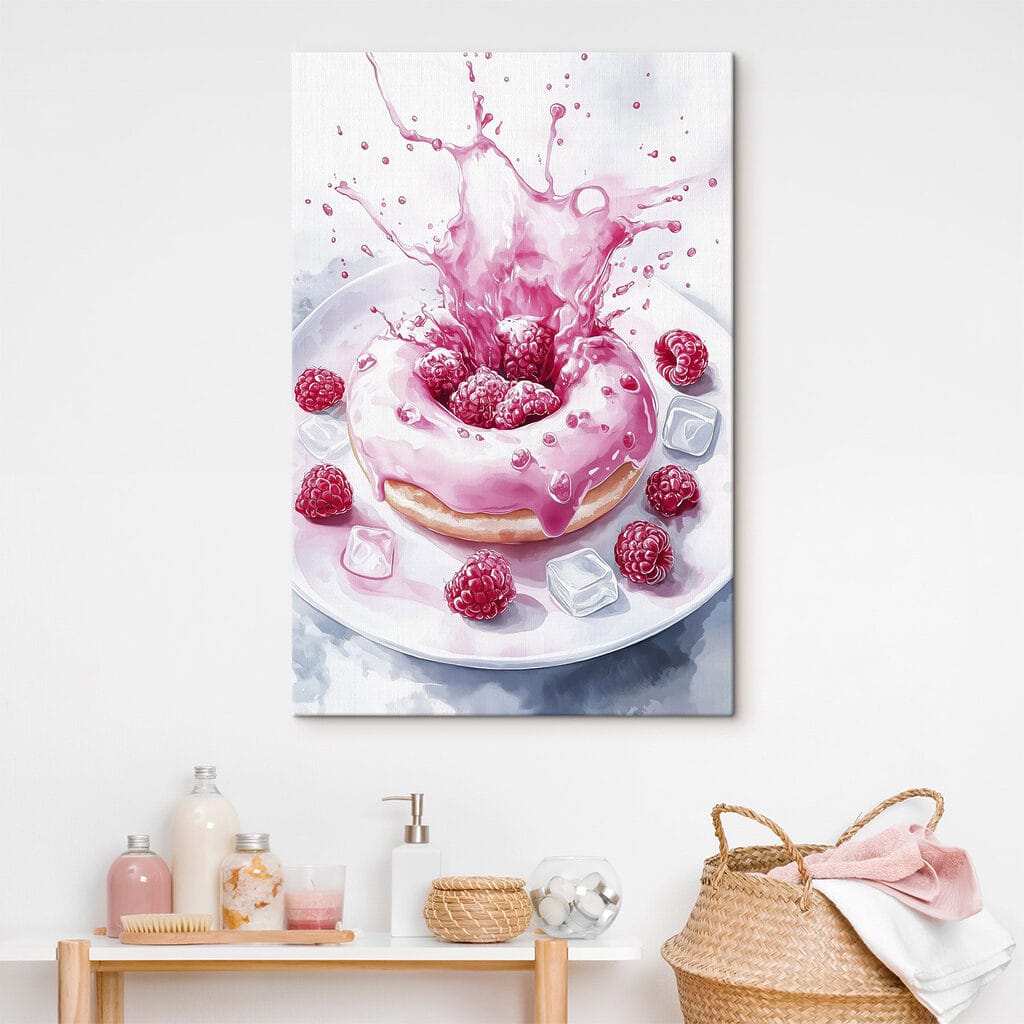 Donut with pink frosting and raspberries splashing into a white plate