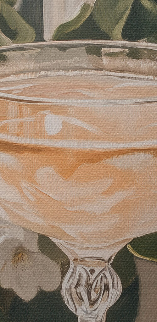 Glass of wine next to flowers