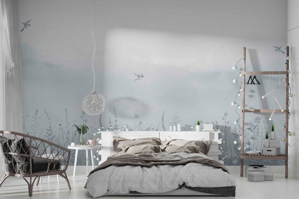 Bird flying over a field of flowers