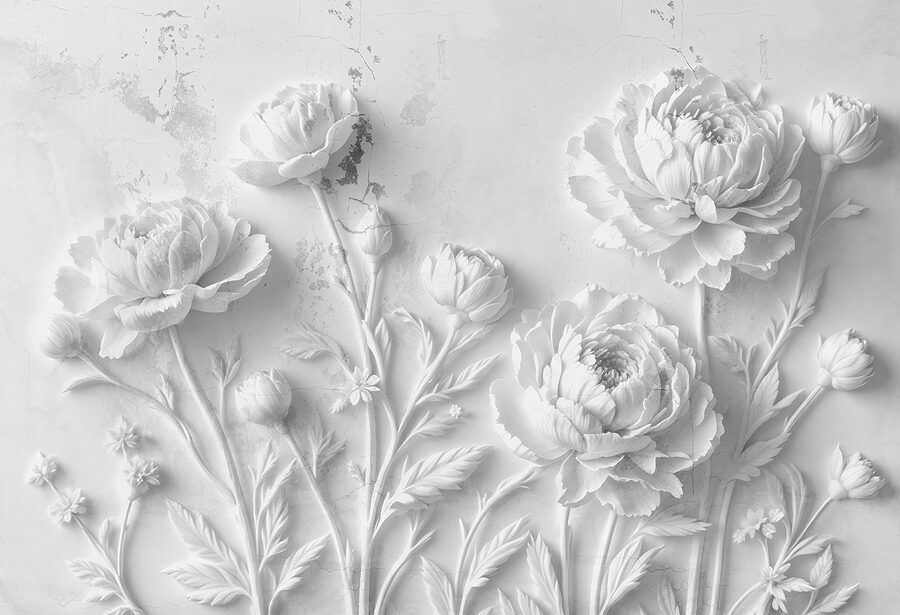 Snijwerk van witte bloemen op een muur