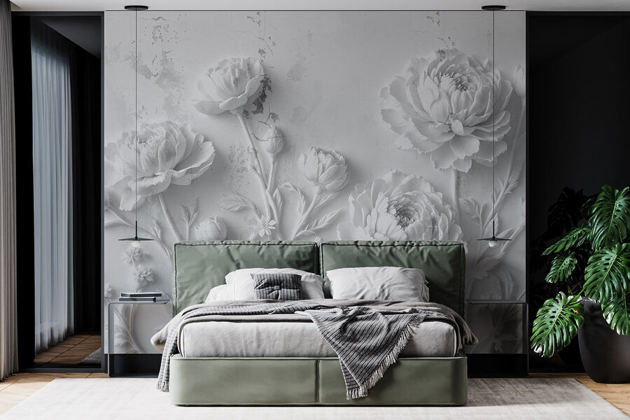 Snijwerk van witte bloemen op een muur