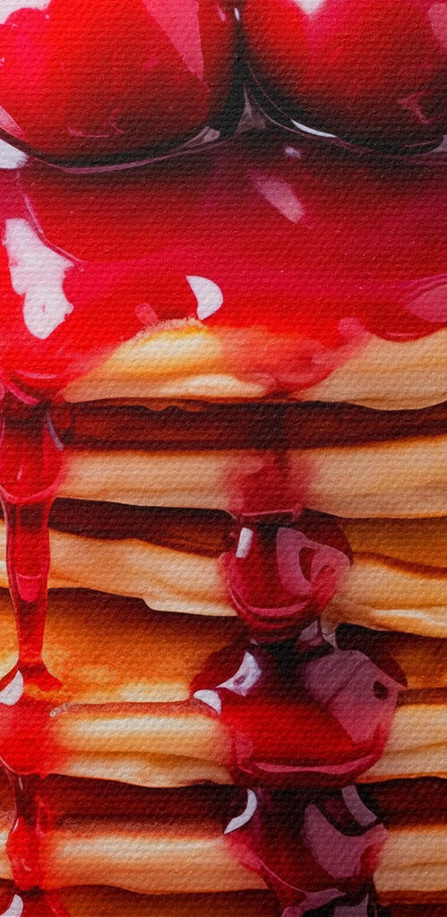 Stack of pancakes with cherry syrup on top