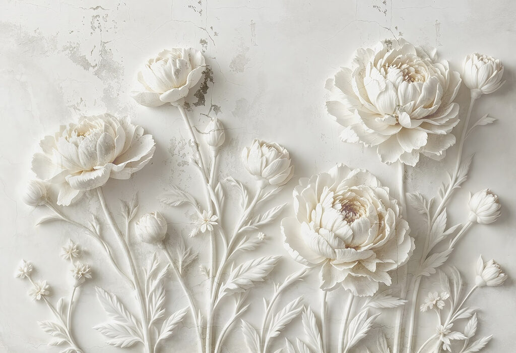 Snijwerk van witte bloemen op een muur Snijwerk van witte bloemen op een muur