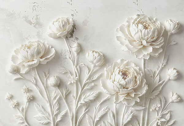 Snijwerk van witte bloemen op een muur Snijwerk van witte bloemen op een muur