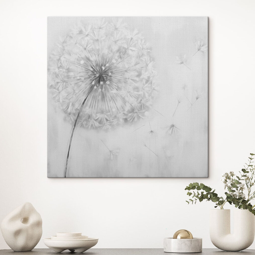Dandelion flower with seeds flying in the air