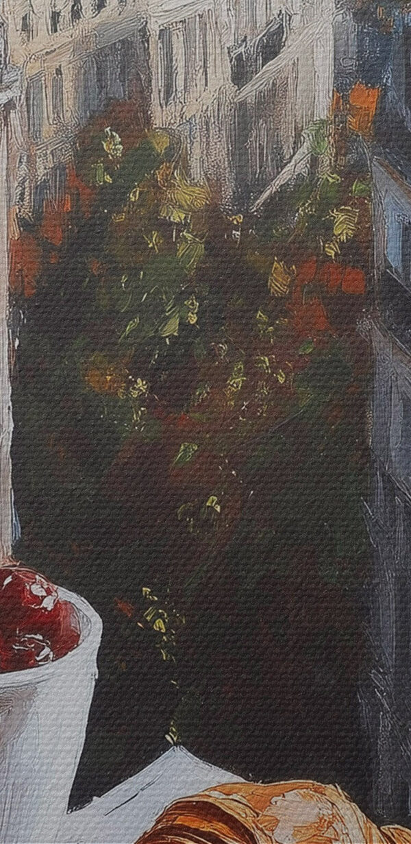 Cup of coffee and croissants on a table with buildings in the background