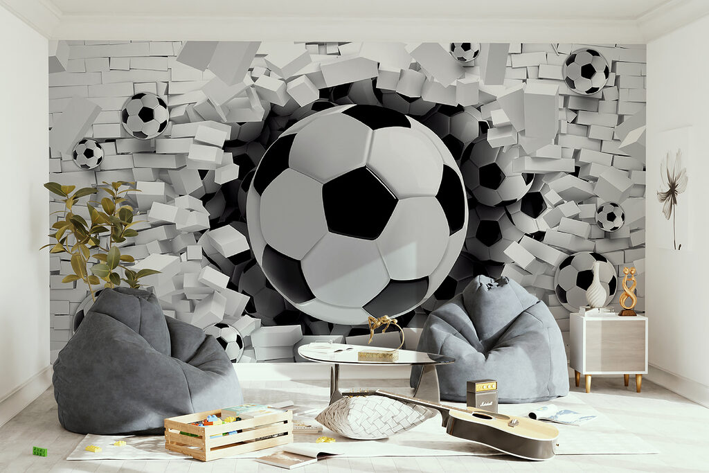 Football ball breaking through a brick wall Football ball breaking through a brick wall