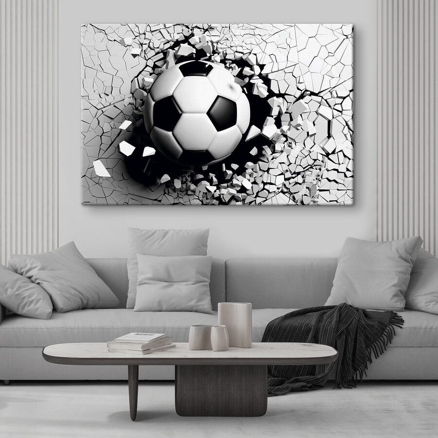 Een voetbal die door een muur breekt