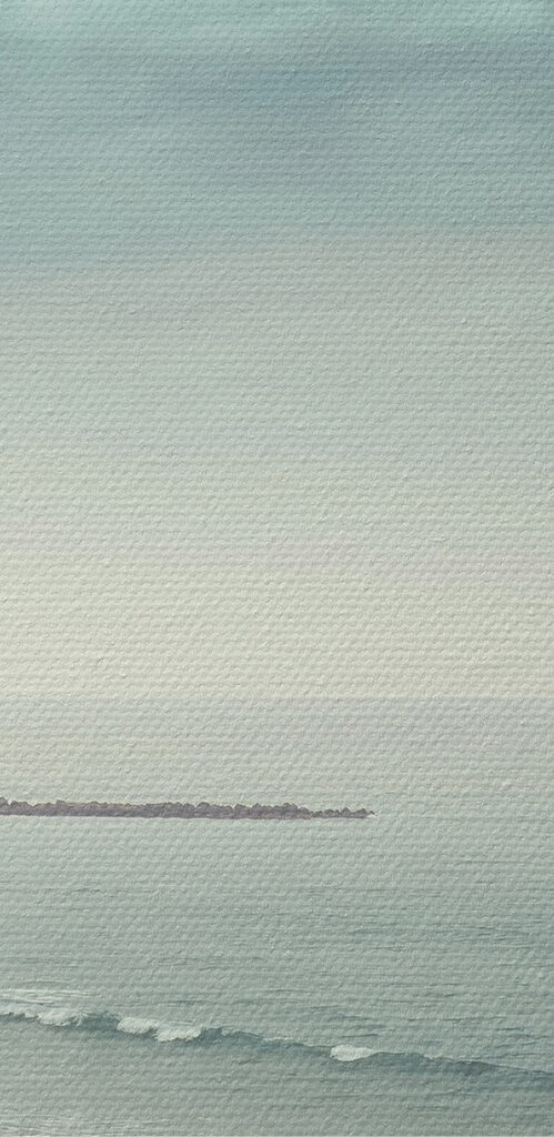 A person walking on a beach