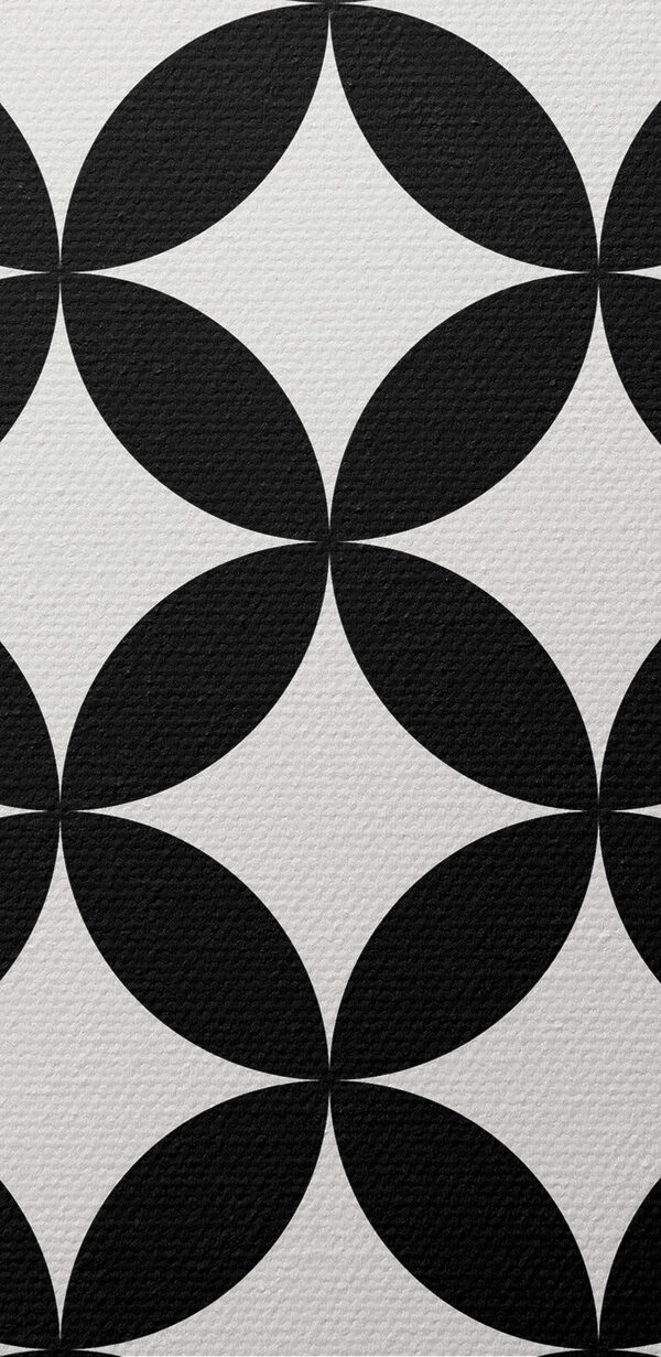 A black and white cover with a pattern of circles