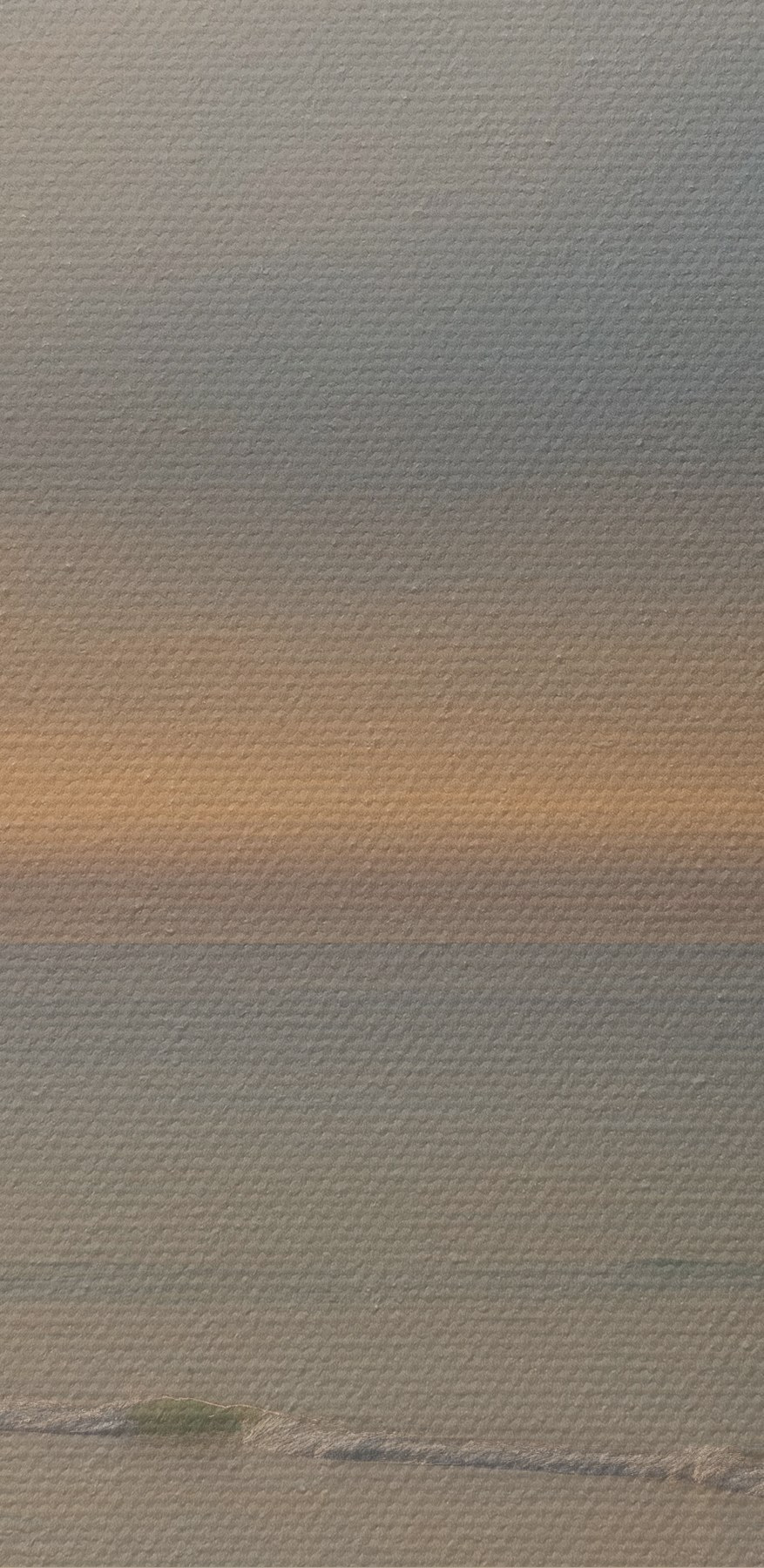 Zonsondergang boven een strand