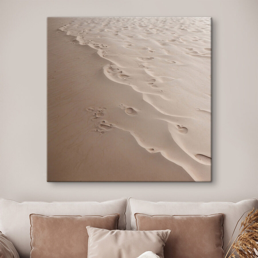 Voetafdrukken in het zand