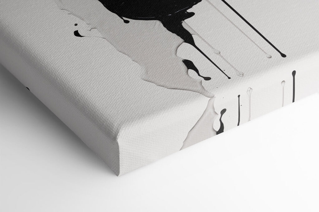 Black and white paint splattered on a white surface Black and white paint splattered on a white surface