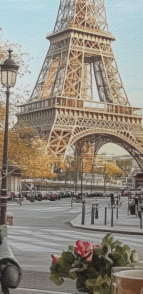 Table with food on it and a table with a tower in the background